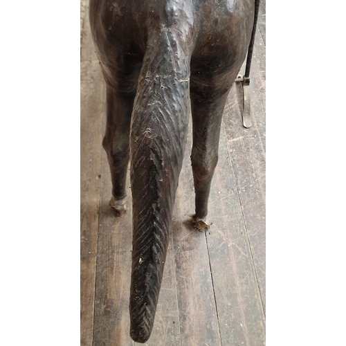 284 - Impressive 19th century French leather horse sculpture on iron trestle base, H 158cm x W 175cm