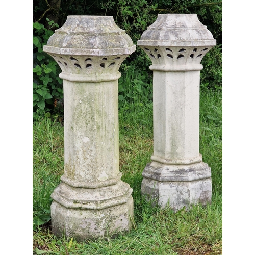 1043 - Pair of reclaimed buff coloured octagonal chimney pots with pierced detail, H 105cm x W 40cm