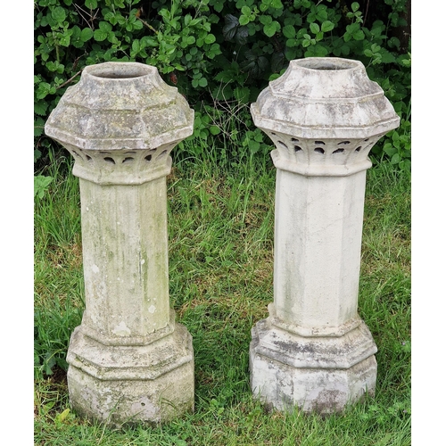 1043 - Pair of reclaimed buff coloured octagonal chimney pots with pierced detail, H 105cm x W 40cm