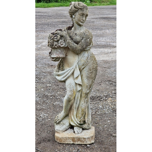 1046 - Weathered reconstituted stone garden statue of a robed maiden holding flowers, H 90cm x W 30cm