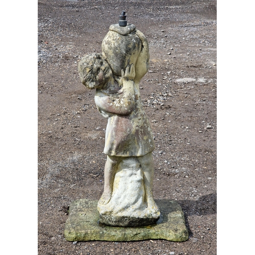 1050 - Weathered reconstituted stone water feature of a girl holding an urn raised on a square base, H 80cm