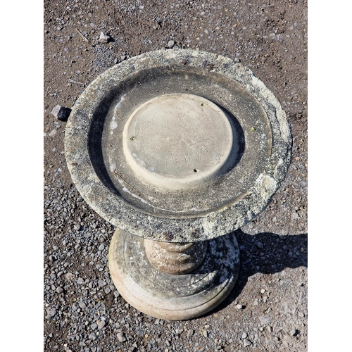 1061 - A weathered reconstituted stone garden bird bath / sundial base with barley twist column, H 55cm x W... 