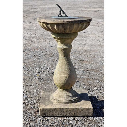 1062 - A reconstituted stone sun dial with baluster column and square cut base, H 65cm x W 35cm