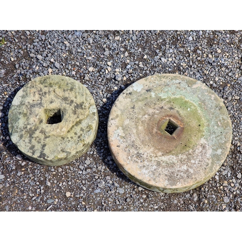 1065 - Two natural stone millstones/grinding wheels of various sizes, 45cm diameter (2)