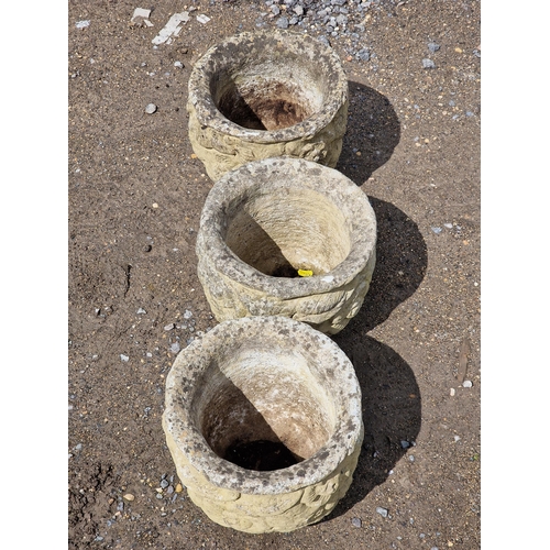 1071 - Three reconstituted stone circular garden planters with floral decoration, H 25cm x W 28cm