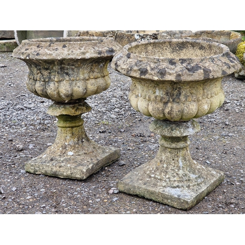 1081 - Pair of weathered reconstituted stone garden urns with lobed bowls, H 41cm x W 37cm (AF) (2)