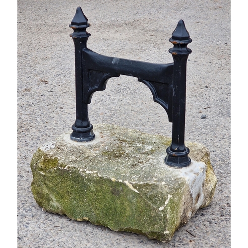 1089 - Painted hexagonal metal boot scraper set in a stone block, H 30cm x W 30cm