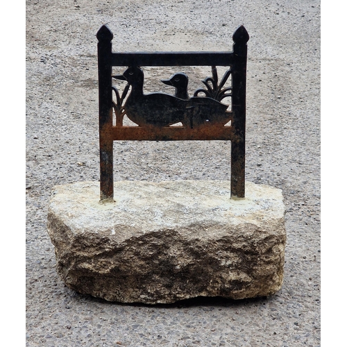 1090 - Painted cast iron boot scraper set in a stone block with pierced decoration depicting a pair of duck... 