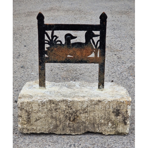 1090 - Painted cast iron boot scraper set in a stone block with pierced decoration depicting a pair of duck... 