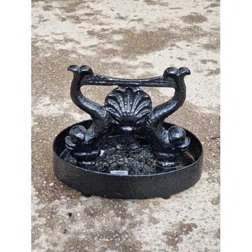 1096 - Painted cast iron boot scraper with stylised fish and shell design , H 25cm x W 32cm x D 20cm