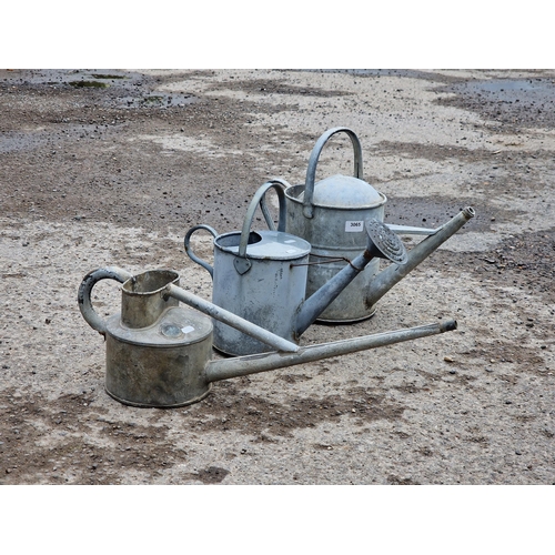 1105 - Three vintage galvanised steel watering cans of various sizes, largest H 40cm (3)