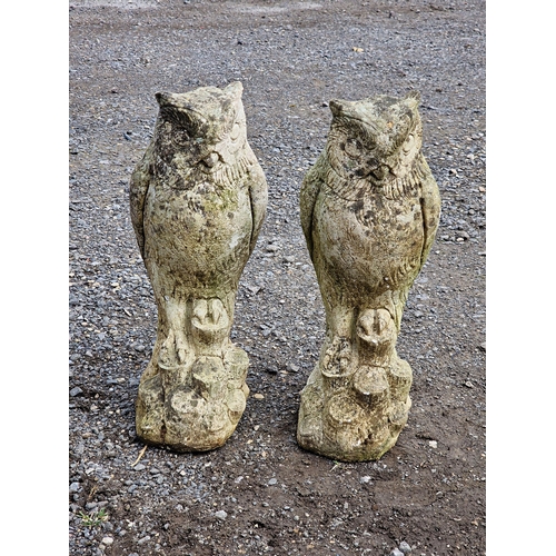 1110 - Two weathered reconstituted stone owl statues, H 38cm (2)