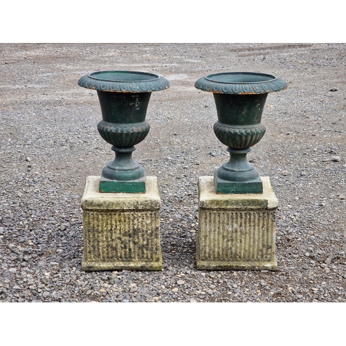 1111 - Pair of small painted cast iron Campana urns with lobed bowls, flared egg and dart rims, raised on s... 