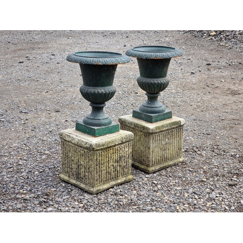 1111 - Pair of small painted cast iron Campana urns with lobed bowls, flared egg and dart rims, raised on s... 