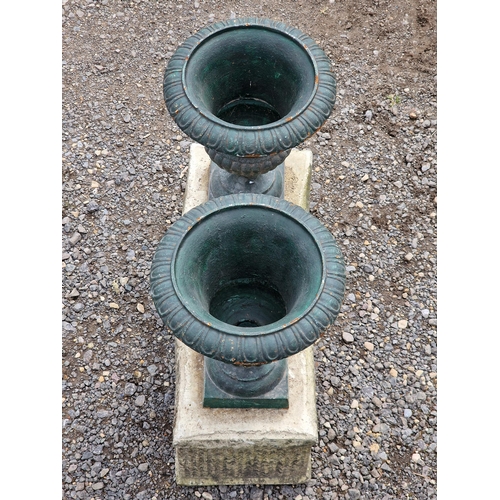 1111 - Pair of small painted cast iron Campana urns with lobed bowls, flared egg and dart rims, raised on s... 