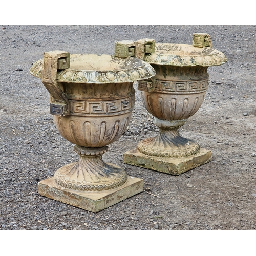 1126 - Pair of weathered reconstituted stone trophy shaped garden urns with flared egg and dart rims, spira... 