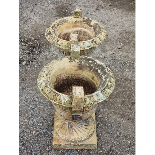 1126 - Pair of weathered reconstituted stone trophy shaped garden urns with flared egg and dart rims, spira... 