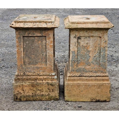 1128 - Pair of weathered reconstituted stone buff coloured pedestals with rope twist detail and fielded col... 