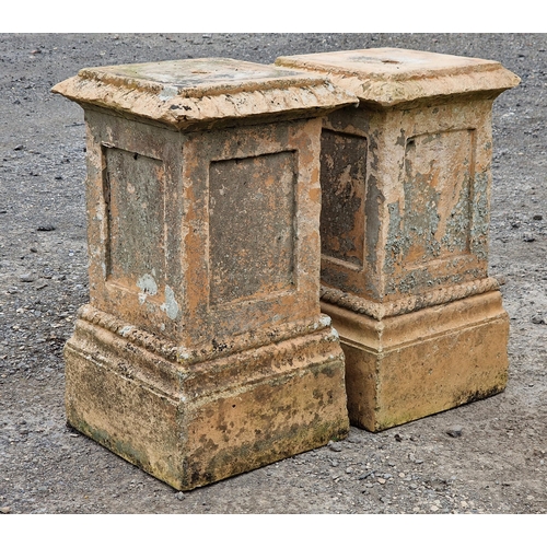 1128 - Pair of weathered reconstituted stone buff coloured pedestals with rope twist detail and fielded col... 