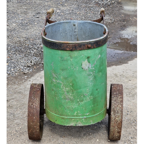 1141 - Vintage push along galvanised steel tank with rivetted seams and original green paintwork, raised on... 