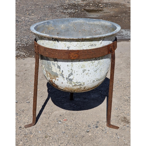 1150 - Vintage metal cauldron raised on a wrought iron stand, H 57cm x W 50cm