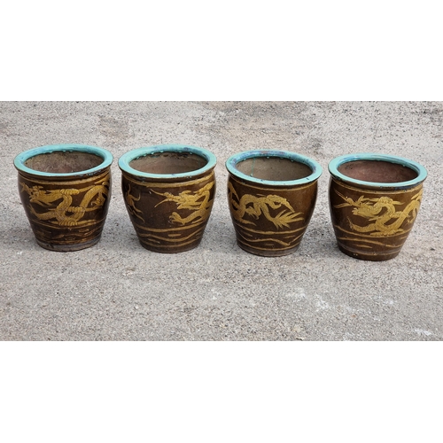 1157 - Four glazed terracotta planters with Chinese dragon decoration, H 35cm x W 39cm (4)