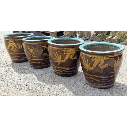 1157 - Four glazed terracotta planters with Chinese dragon decoration, H 35cm x W 39cm (4)