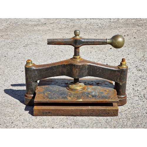 1164 - Antique cast iron book press with brass handle and mounts, H 40cm x W 60cm