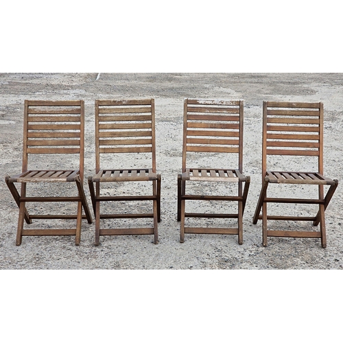 1194 - Four teak folding garden chairs with slatted seats and backs, H 88cm (4)