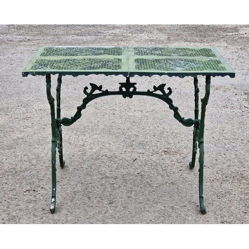 1199 - Painted metal garden table with scrolled and pierced detail, H 70cm x W 94cm