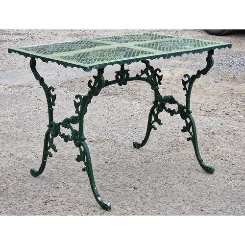 1199 - Painted metal garden table with scrolled and pierced detail, H 70cm x W 94cm