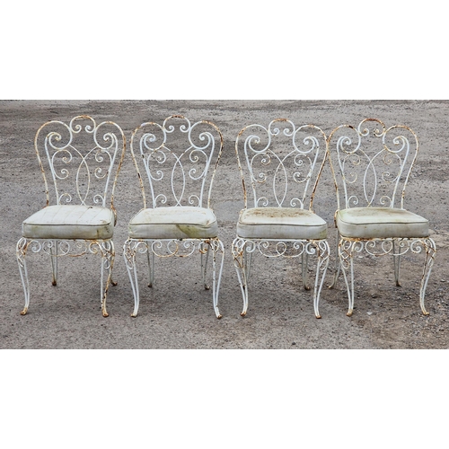 1202 - Set of four painted metal garden chairs with scrolling pierced detail and upholstered cushions, H 90... 