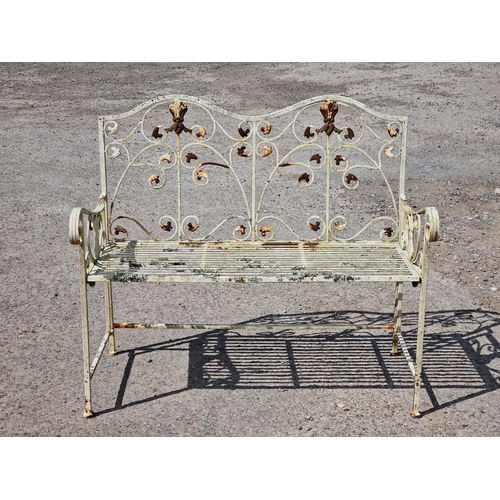 1207 - Painted metal garden bench with scrolling pierced detail, H 91cm x W 105cm