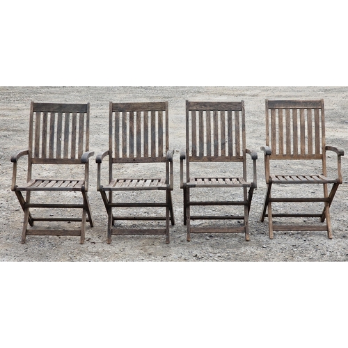 1229 - Set of four weathered teak folding garden armchairs, H 97cm (4) (AF)