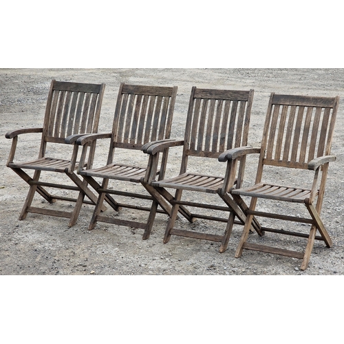 1229 - Set of four weathered teak folding garden armchairs, H 97cm (4) (AF)