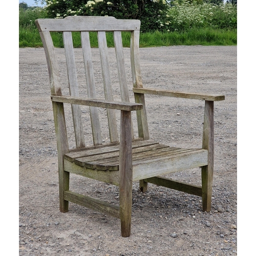 1232 - Three piece teak garden set to include a bench and two chairs with slatted seats and backs, raised o... 