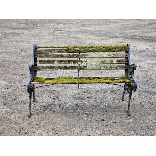 1233 - Antique cast iron garden bench with scrolling pierced detail and distressed paintwork, H 78cm x W 12... 