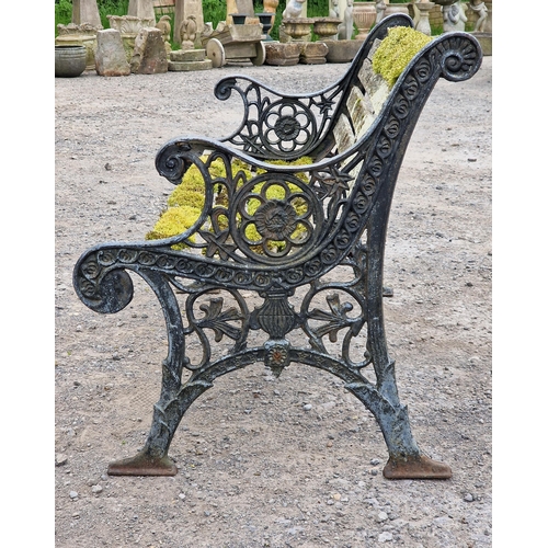 1233 - Antique cast iron garden bench with scrolling pierced detail and distressed paintwork, H 78cm x W 12... 