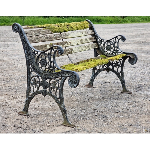 1233 - Antique cast iron garden bench with scrolling pierced detail and distressed paintwork, H 78cm x W 12... 