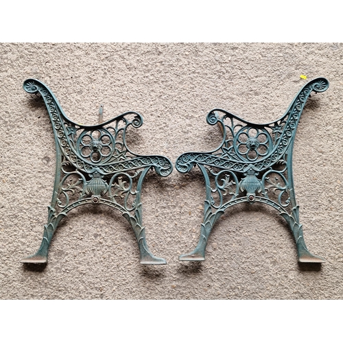 1237 - A pair of cast iron bench ends with pierced scrolling detail and green paintwork, H 72cm