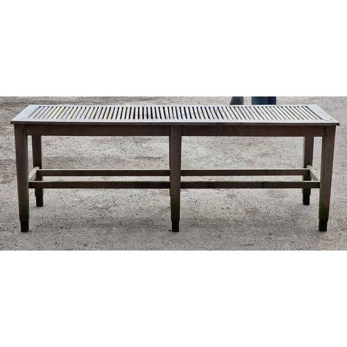 1020 - Good silvered teak potting bench/table the slatted top upon six legs with two stretchers, 76cm high ... 