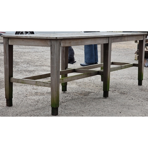 1020 - Good silvered teak potting bench/table the slatted top upon six legs with two stretchers, 76cm high ... 