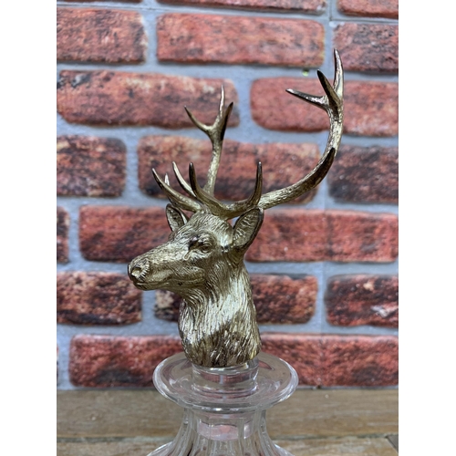 319 - Cut glass decanter with impressive silver plated stag head stopper, H 32