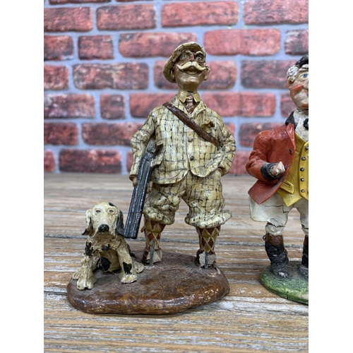 322 - Two hand made clay pottery figures depicting comical huntsman with hounds, H 15cm