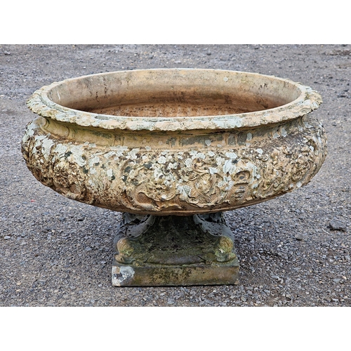 1125 - Weathered reconstituted stone two sectional garden urn with flared rim and scrolling foliate relief ... 