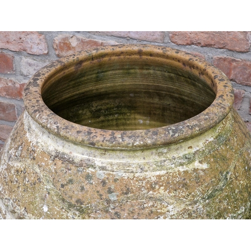 1002 - Good antique well weathered terracotta amphora, with pressed banded decoration, 65cm high