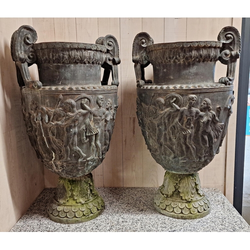 1021 - Impressive pair of grand tour lead twin handled urns, the scrolled handles with darted rim over a ba...