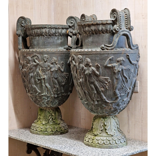 1021 - Impressive pair of grand tour lead twin handled urns, the scrolled handles with darted rim over a ba... 