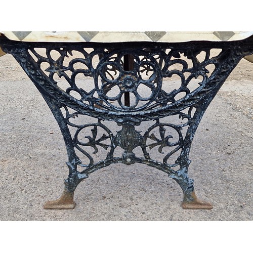 1270 - Painted cast iron garden table with decorative pierced detail and vinyl cover top, H 67cm x W 116cm ... 