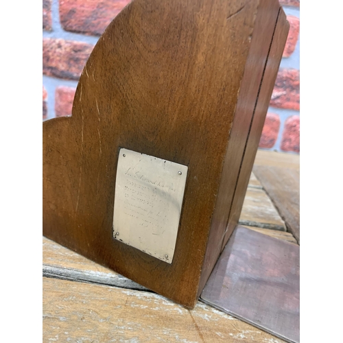 2171 - Pair of carved mahogany bookends inset with plaques, one displaying a coat of arms and another being... 